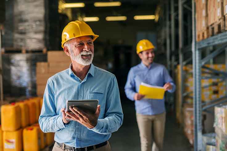 supervisor walking through warehouse