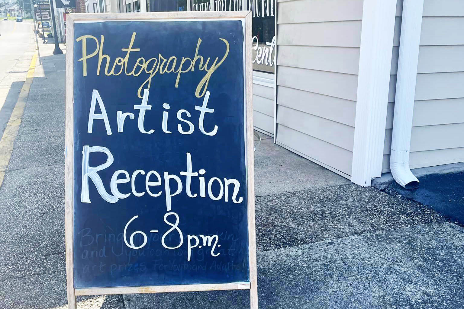 artist reception chalkboard sign photo